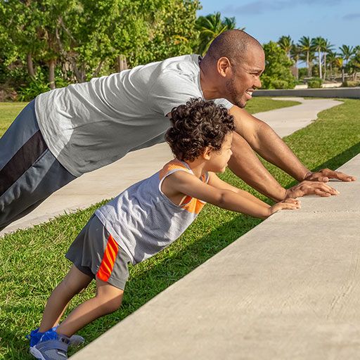Father and Son Enjoying Time with Each Other Working Out Getting Fit